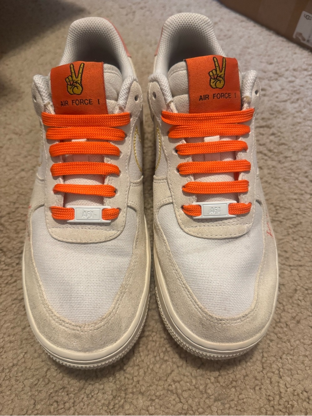 Nike Women’s White Sneakers with Bright Orange Accents